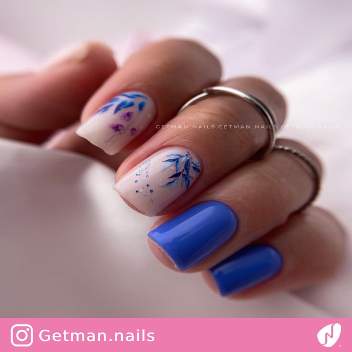 Glossy Blue Nails Leaf Design